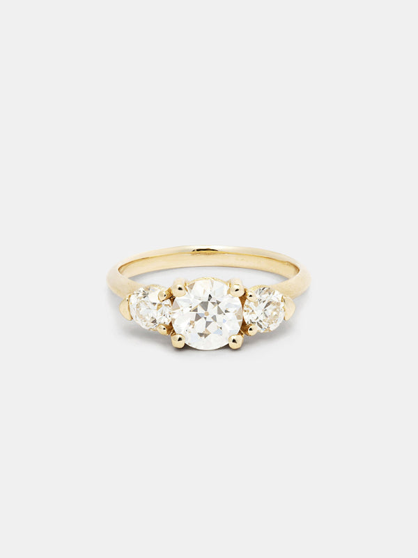 Shown: 1ct near colorless antique center stone with 0.3ct near colorless antique side stones in 14k yellow gold with organic texture and signature matte finish.