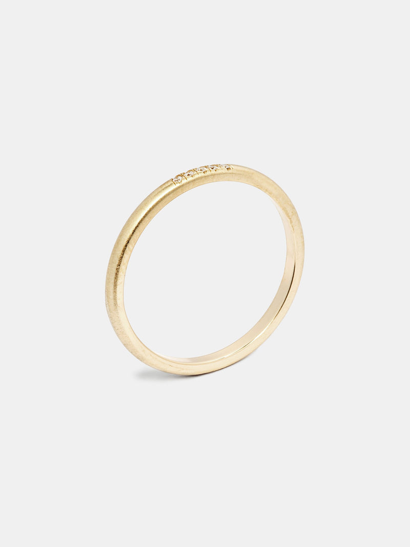 Anise Band in 14k yellow gold with five 1mm recycled diamonds and signature matte finish.