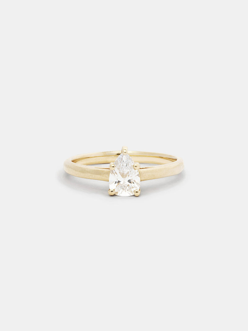 Shown: 0.5ct colorless recycled pear diamond in 14k yellow gold with organic texture and signature matte finish. 