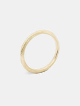 Knife Band- 1.5mm in 14k yellow gold with organic texture and signature matte finish.