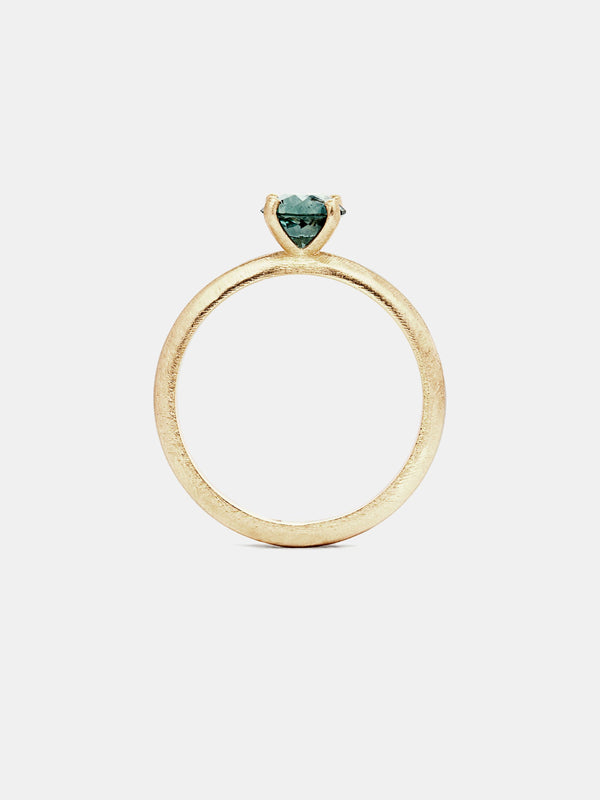 Marigold Solitaire- Sapphire with 0.75ct teal Montana sapphire in 14k yellow gold with organic texture and signature matte finish.