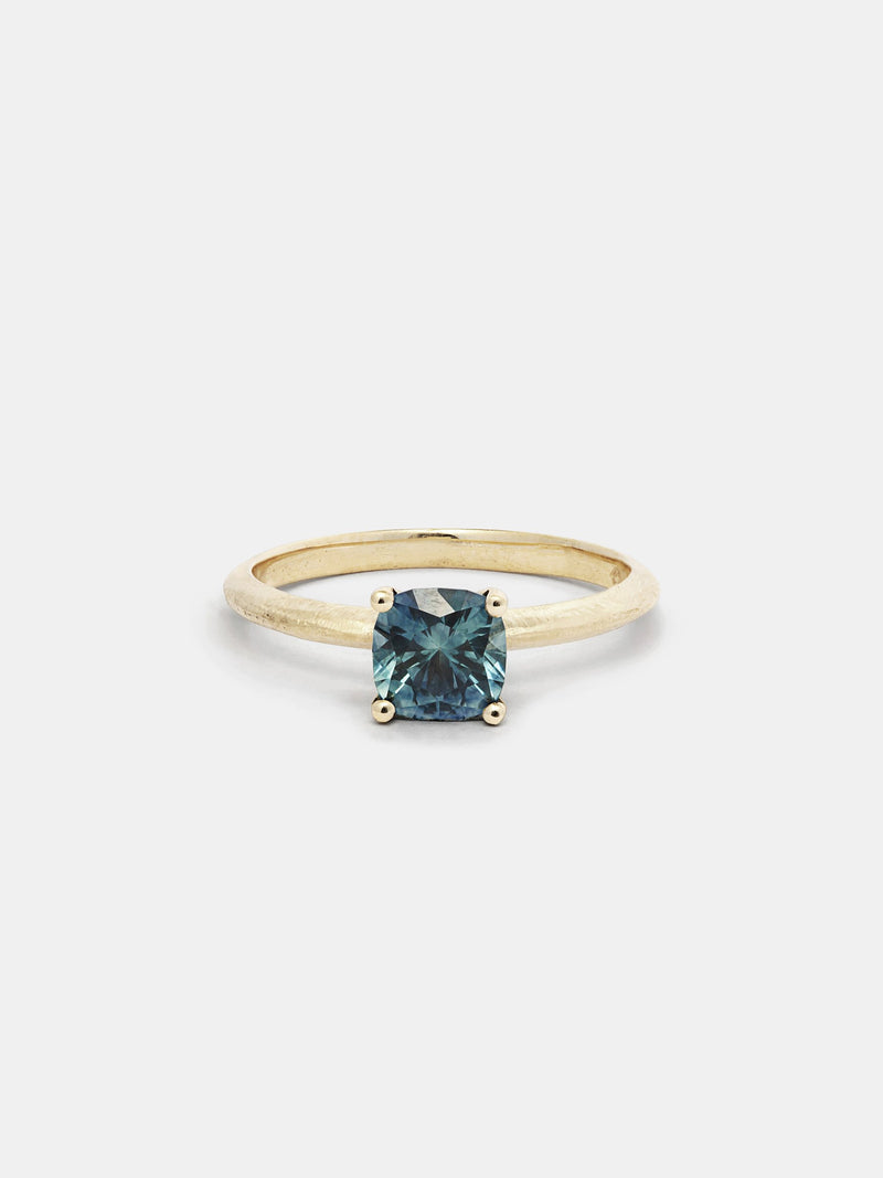 Shown: 1ct teal Montana sapphire 14k yellow gold with organic texture and signature matte finish.