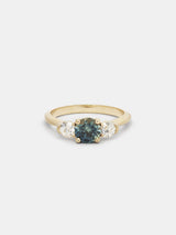 Shown: 0.75ct viridian Montana sapphire center stone with 0.25ct near colorless antique side stones in 14k yellow gold with organic texture and signature matte finish.