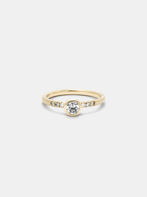 Shown: 0.25ct Near Colorless diamond in 14k yellow gold with diamond pave, smooth texture and signature matte finish.