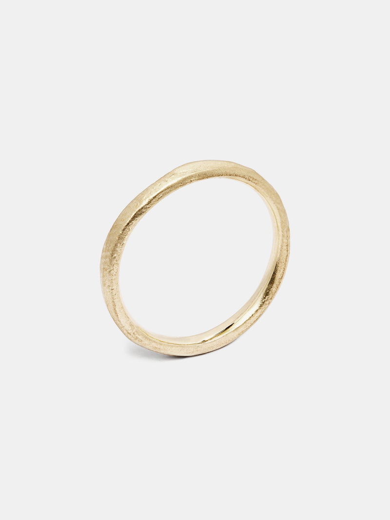 Zinnia Band in 14k yellow gold with organic texture and signature matte finish.